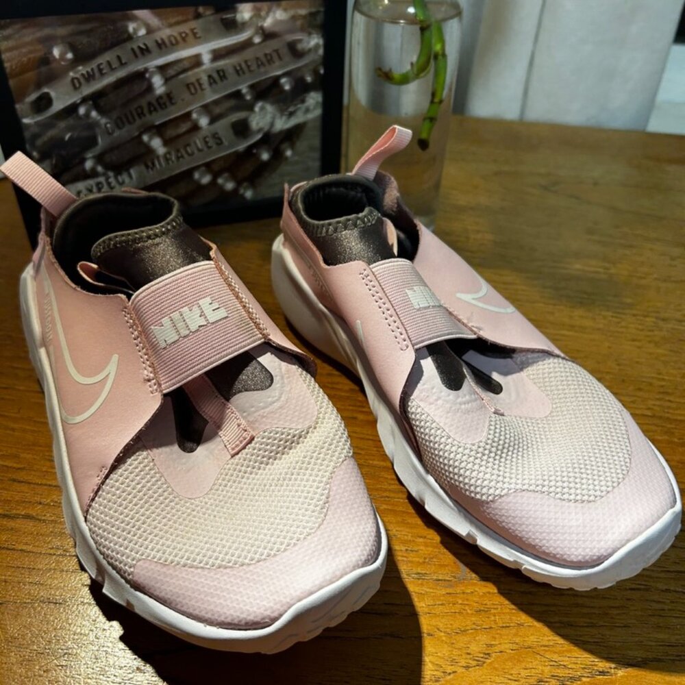 pink Nike slip-on's